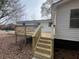 Back of house with newly built deck and stairs, perfect for entertaining guests at 6140 North St, Covington, GA 30014