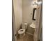 Neat and tidy powder bathroom with a new toilet and sink at 2438 Brianna Dr, Hampton, GA 30228