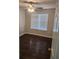 Bedroom featuring wood-look flooring, a ceiling fan, and natural light from a window at 2438 Brianna Dr, Hampton, GA 30228