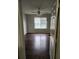 Bedroom featuring wood-look flooring and natural light from a large window at 2438 Brianna Dr, Hampton, GA 30228