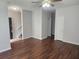 An inviting living room featuring beautiful laminate flooring and a neutral color palette at 2438 Brianna Dr, Hampton, GA 30228