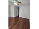 Bright and airy living room featuring new laminate floors, and a modern ceiling fan at 2438 Brianna Dr, Hampton, GA 30228
