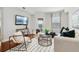 Modern living room with hardwood floors, neutral decor, and balcony access at 230 E Ponce De Leon Ave # 524, Decatur, GA 30030