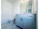 Modern bathroom with gray vanity and white tile at 3157 Moor View Rd # 34, Duluth, GA 30096