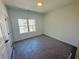 Bright bedroom with a large window and carpet flooring at 3157 Moor View Rd # 34, Duluth, GA 30096