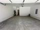 Unfinished garage with concrete floor and high ceilings at 3157 Moor View Rd # 34, Duluth, GA 30096