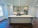 Modern kitchen with white cabinets and large island at 3157 Moor View Rd # 34, Duluth, GA 30096