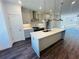 Modern kitchen with white cabinets and a large island at 3157 Moor View Rd # 34, Duluth, GA 30096