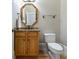 Powder room features an octagon mirror and granite vanity at 6191 Talmadge Run, Acworth, GA 30101