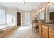 Luxurious bathroom with double vanities, a soaking tub, a walk-in shower, and elegant finishes at 6191 Talmadge Run, Acworth, GA 30101