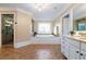 Luxurious bathroom with a soaking tub, separate shower, and elegant tile work at 6191 Talmadge Run, Acworth, GA 30101