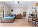 Bright bedroom featuring hardwood floors, a large window, and a rustic wooden bed frame at 6191 Talmadge Run, Acworth, GA 30101