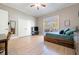 Spacious bedroom boasts hardwood floors, a large window, closet and neutral paint at 6191 Talmadge Run, Acworth, GA 30101