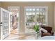 Bedroom view from inside, of an outdoor deck area and a comfortable chair for reading at 6191 Talmadge Run, Acworth, GA 30101