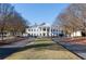 The stately clubhouse with classic architecture, surrounded by manicured lawns and mature trees at 6191 Talmadge Run, Acworth, GA 30101
