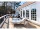 Back deck featuring windows to the house, Adirondack chairs, outdoor grill, and chaise lounges at 6191 Talmadge Run, Acworth, GA 30101