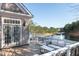 View of outdoor seating on the deck overlooking the lake at 6191 Talmadge Run, Acworth, GA 30101