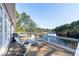 Inviting deck features a grill, several chairs, and a great view of the lake and water feature at 6191 Talmadge Run, Acworth, GA 30101
