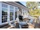 Back deck featuring windows to the house, Adirondack chairs, outdoor grill, and chaise lounges at 6191 Talmadge Run, Acworth, GA 30101