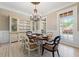 Dining room featuring a decorative chandelier and a classic china cabinet at 6191 Talmadge Run, Acworth, GA 30101