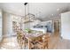 Dining area with modern lighting and access to the kitchen at 6191 Talmadge Run, Acworth, GA 30101