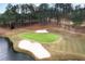 Picturesque golf course with manicured green, sand traps and a tranquil lake view at 6191 Talmadge Run, Acworth, GA 30101
