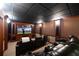 Luxury home theater with comfortable recliners, a large screen, and immersive sound system at 6191 Talmadge Run, Acworth, GA 30101