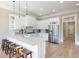 Bright kitchen features a breakfast bar with seating and stainless steel appliances at 6191 Talmadge Run, Acworth, GA 30101