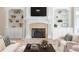 Bright living room with custom built-ins flanking a fireplace, providing ample display and storage space at 6191 Talmadge Run, Acworth, GA 30101