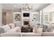 Comfortable living room with fireplace, custom built-ins, and lots of seating for entertaining at 6191 Talmadge Run, Acworth, GA 30101