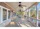 Large covered back porch features a brick wall, and view of the lake at 6191 Talmadge Run, Acworth, GA 30101