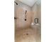 Modern walk-in shower with neutral tile, a built-in bench, and sleek fixtures at 6191 Talmadge Run, Acworth, GA 30101