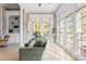 Sunroom featuring lots of natural light, with large windows, access to an outdoor space and hardwood flooring at 6191 Talmadge Run, Acworth, GA 30101