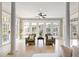 Light-filled sunroom with large windows and hardwood floors at 6191 Talmadge Run, Acworth, GA 30101