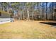 Spacious backyard with a large grassy area and wooded backdrop at 175 Smith Ferguson Rd, Dallas, GA 30157