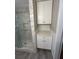 Bathroom features a marble shower and additional storage cabinets at 175 Smith Ferguson Rd, Dallas, GA 30157