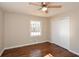 Hardwood floor bedroom with closet and ceiling fan at 175 Smith Ferguson Rd, Dallas, GA 30157