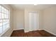 Bright bedroom with hardwood floors and a double-door closet at 175 Smith Ferguson Rd, Dallas, GA 30157