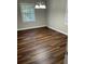 Dining room with dark hardwood floors and a light fixture at 175 Smith Ferguson Rd, Dallas, GA 30157