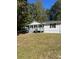 White ranch house with a spacious yard and trees at 175 Smith Ferguson Rd, Dallas, GA 30157