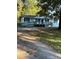 Ranch home with gray ramp and steps leading to covered porch at 175 Smith Ferguson Rd, Dallas, GA 30157