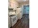 Renovated kitchen, featuring white cabinets, new appliances, and vinyl flooring at 175 Smith Ferguson Rd, Dallas, GA 30157