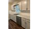 Modern kitchen with gray cabinets, marble countertops, and stainless steel dishwasher at 175 Smith Ferguson Rd, Dallas, GA 30157