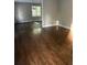 Bright living room with dark hardwood floors at 175 Smith Ferguson Rd, Dallas, GA 30157