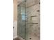 Large walk-in shower with marble tile and frameless glass door at 175 Smith Ferguson Rd, Dallas, GA 30157