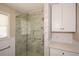 Walk-in shower with marble tile and glass door at 175 Smith Ferguson Rd, Dallas, GA 30157