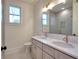 Clean bathroom with double sinks, quartz countertop and shower at 211 Iroquois Ct, Covington, GA 30014