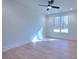 Well-lit bedroom with hardwood floors and large window at 211 Iroquois Ct, Covington, GA 30014