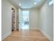 Bright bedroom with hardwood floors and access to a luxurious bathroom at 211 Iroquois Ct, Covington, GA 30014