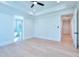 Light-filled bedroom with hardwood floors, high ceilings and ensuite bath at 211 Iroquois Ct, Covington, GA 30014